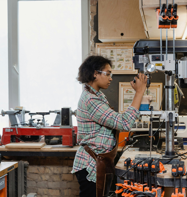 Maker working on a drill press